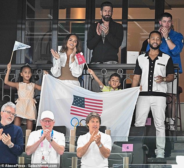 The family was joined at the gymnastics event by Hollywood stars Nick Jonas (top right) and Tom Cruise (bottom right)