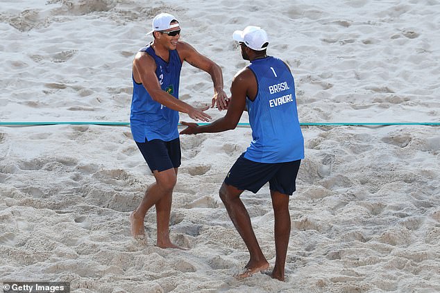 While women traditionally wear bikinis in beach volleyball at the Olympics, men are now allowed to wear singlets and shorts