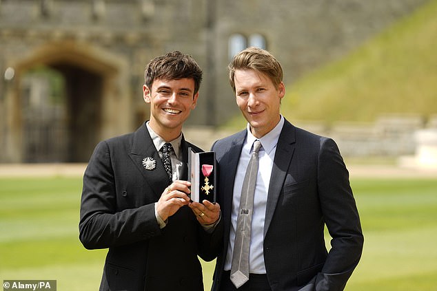 Dustin appears to be a devoted husband in every way as he supports Tom as he receives his OBE