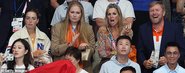 PASSIONATE: At one point the Queen was seen screaming, while her husband smiled broadly as they watched the event