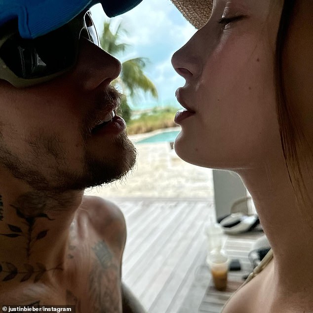 In another photo, the couple is seen sharing a romantic moment just inches from each other's faces as they enjoy a day at the pool