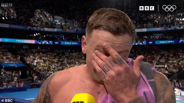 An emotional Adam burst into tears during a TV interview before walking to the stands to hug his loved ones