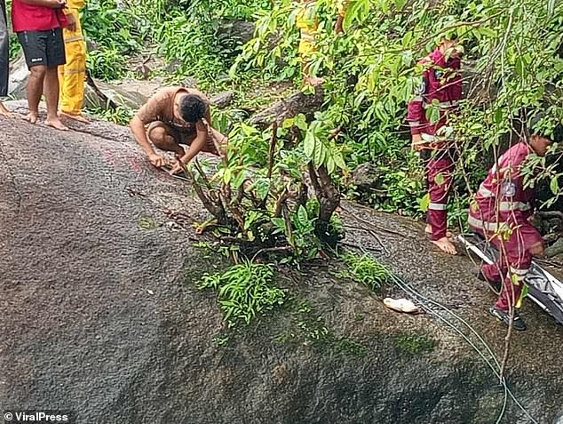 The young girl was swept away by the fast flowing current and her body became trapped between two large boulders