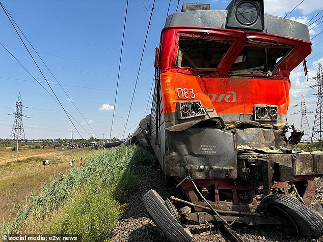 The mangled train car can be seen after the collision