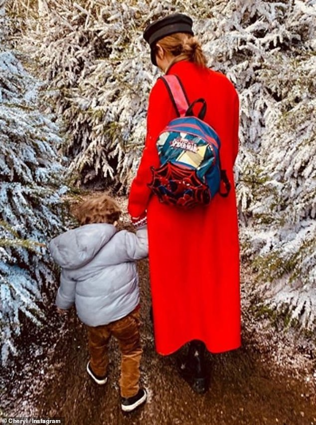 Cheryl took to Instagram to share a snap of herself walking hand-in-hand with her son through Lapland UK in 2019