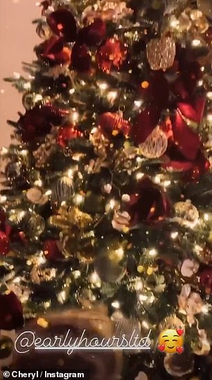 The bear's head was just visible on Cheryl's story when she shared a video of her large red and gold Christmas tree