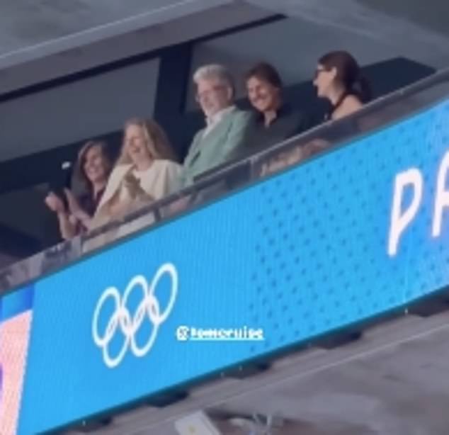 The Hollywood actor blew kisses to fans as he watched a swimming relay event after cheering on Simone Biles in the women's gymnastics