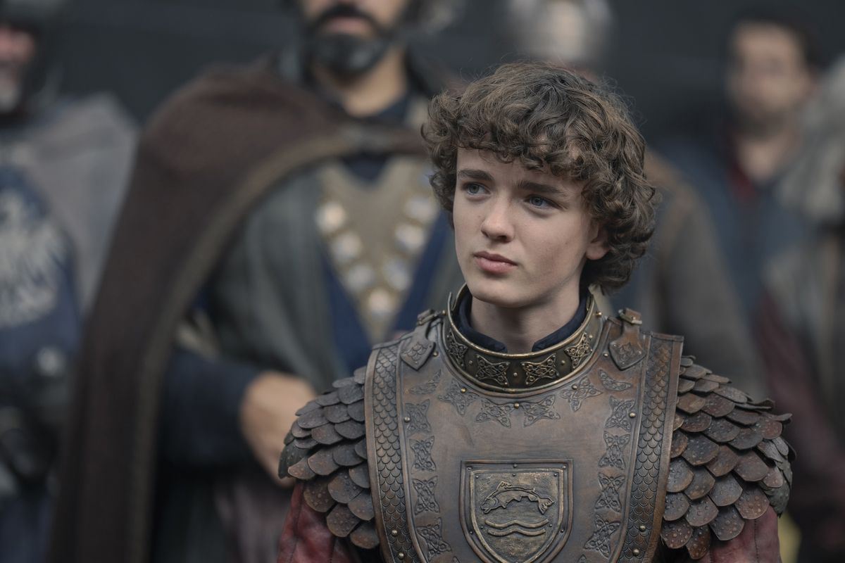 Young Oscar Tully stands in his armor before the other River Lords in House of the Dragon season 2