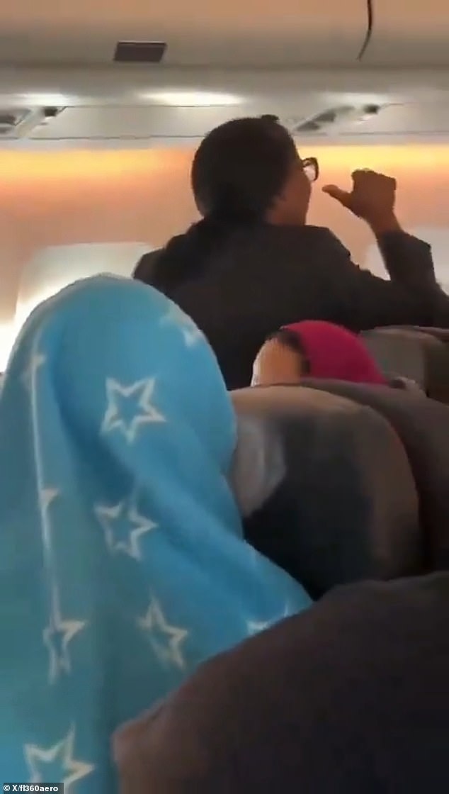 Angry female flight attendant was filmed gesturing in French and English at unseen passenger on plane flying from Montreal to Casablanca, Morocco