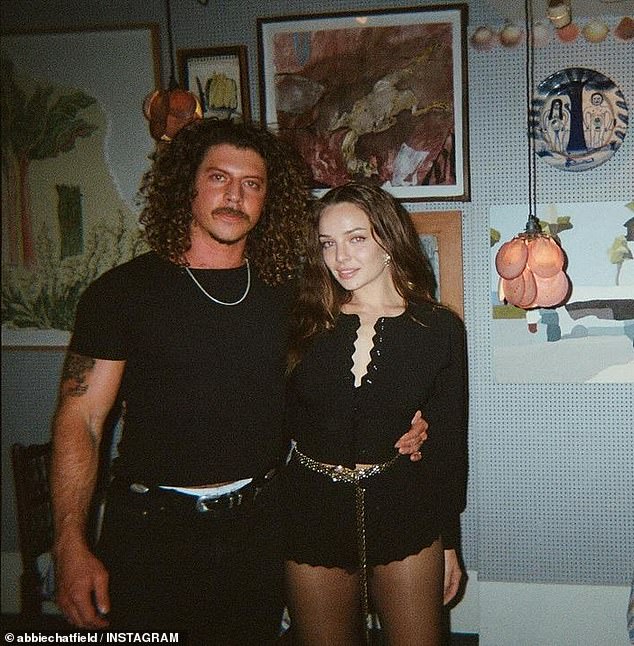 It comes after Abbie stood up for her new man amid concerns from fans that he is 'using' her for fame. Pictured: Abbie and her Peking Duk musician boyfriend Adam Hyde