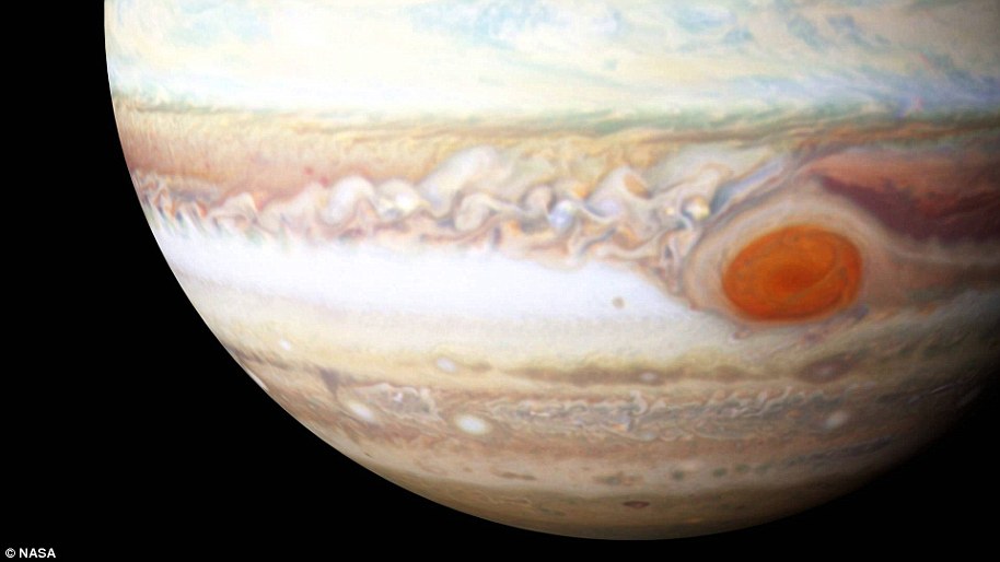 Jupiter's Great Red Spot is a giant oval of crimson clouds in Jupiter's southern hemisphere that race counterclockwise around the circumference of the oval