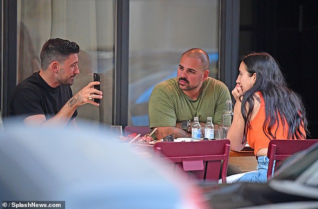 Pernice was spotted checking his phone during an outdoor lunch date with two friends outside a restaurant in London