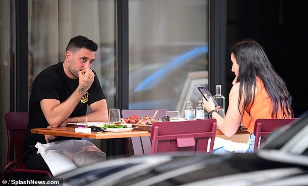 The Sicilian dancer chatted with friends on Monday afternoon as she took up a table outside