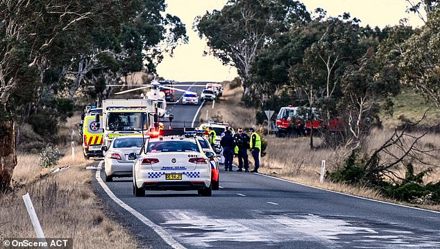 The driver was airlifted to Canberra Hospital where he remains in a stable condition. Pictured are emergency workers at the scene