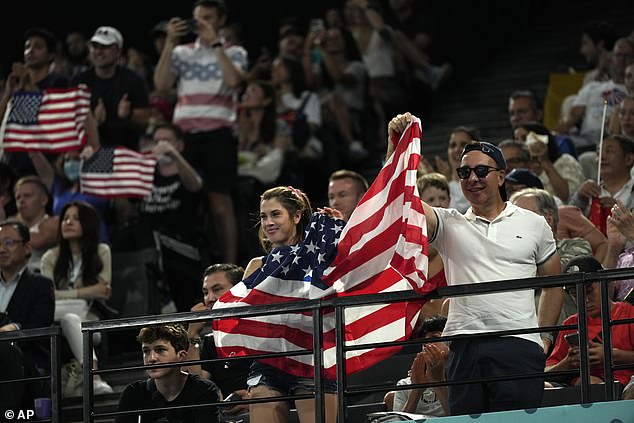 American fans proudly held the American flag aloft at the Bercy Arena in Paris, France on Monday