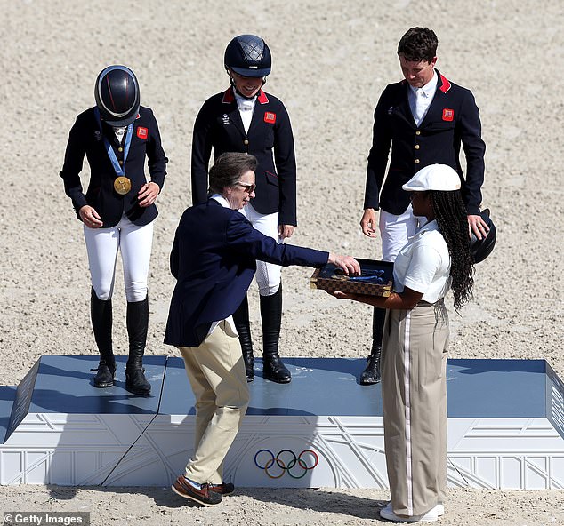 The Team GB trio of horses were presented with their medals by Princess Anne (bottom centre)