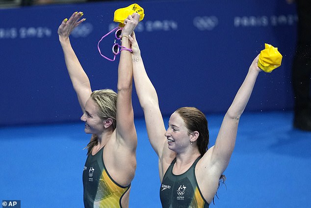 The world's two fastest women are pictured greeting the crowd after the race