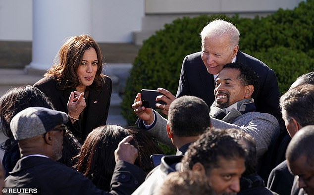 US Vice President Kamala Harris (left) and US President Joe Biden meet with supporters at the White House