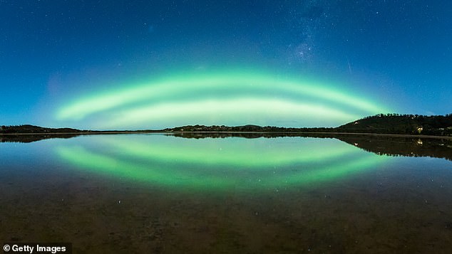 It is unclear what time the solar storm will reach Australia, and the chance of seeing an aurora is 'very uncertain'