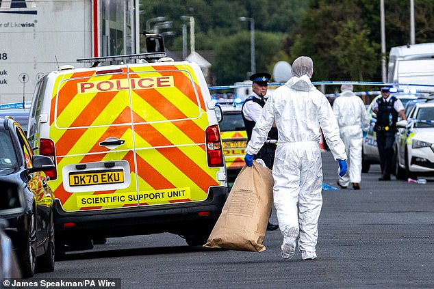 Forensic officers on Hart Street in Southport, Merseyside, after a shocking knife attack