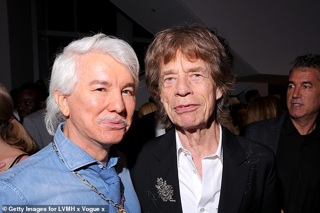 Baz's unusual look has been the subject of much fan comment. He is pictured with Mick Jagger at the event