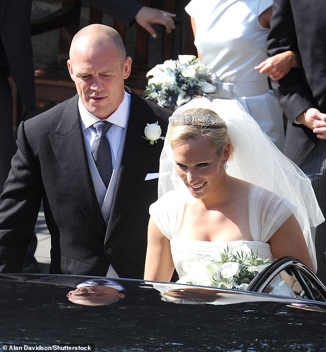 The bride and groom pictured getting into their limousine after the wedding ceremony