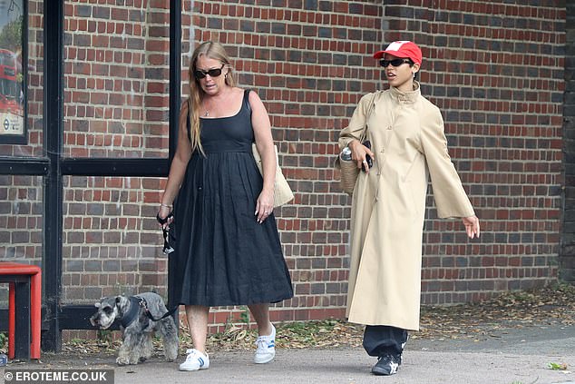 The woman with her, presumably her mother, wore a stylish black summer dress which she wore with white sneakers