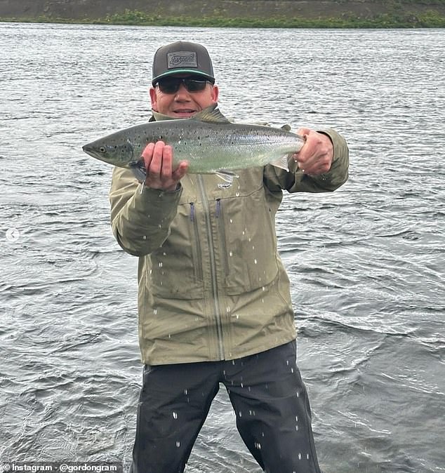 In a series of Instagram snaps, the Kitchen Nightmares presenter posed in full waterproof gear and held up a large salmon as he grinned at the camera, knee-deep in water