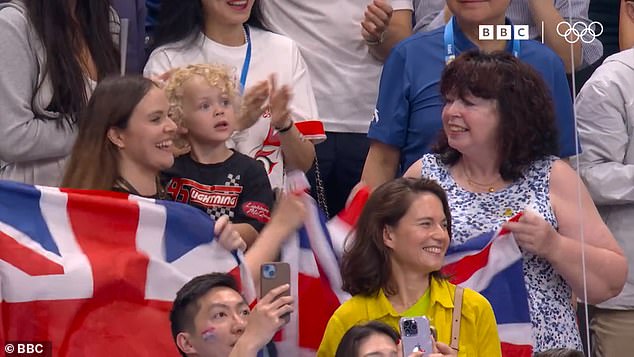 Holly watched and cheered Adam on in the breaststroke final, along with his three-year-old son George, his former partner Eirianedd Munro and his mother Caroline