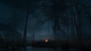 An Ent approaches a human at night in The Rings of Power season 2