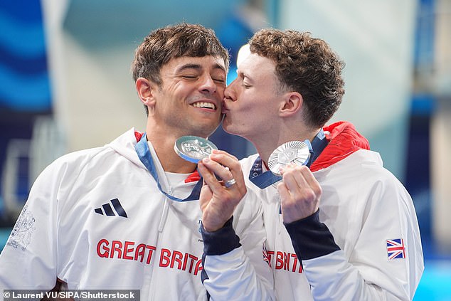 Tom won silver in the 10m synchro platform event with Noah Williams, who planted a kiss on his teammate's cheek during the medal ceremony