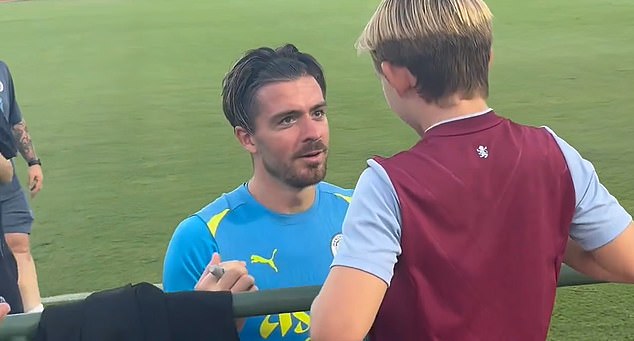 Grealish (left) appeared to ask the Villa fan 'if they still liked him' despite the winger leaving his boyhood club to join Man City in 2021