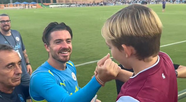 The pair shook hands after the foodballer signed the supporter's Aston Villa shirt