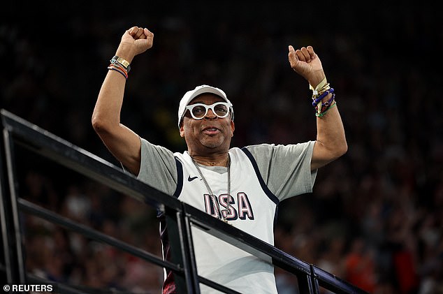 Film director Spike Lee wore a white American vest with matching cap and dark sweatpants