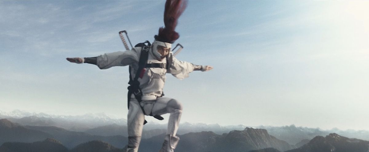 Shatterstar (Lewis Tan) jumps out of a plane in a blur of motion during an action scene in Deadpool 2