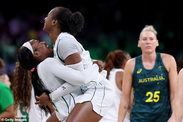 Team Nigeria's Elizabeth Balogun and Adebola Adeyeye celebrate victory against the Opals in their opening match of the Olympic Games