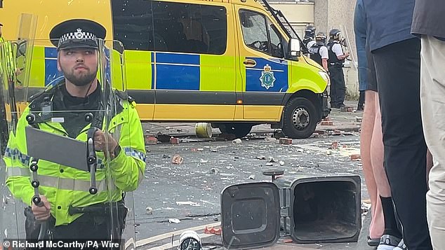 Chaotic scenes broke out yesterday near the scene of the knife attack in Southport