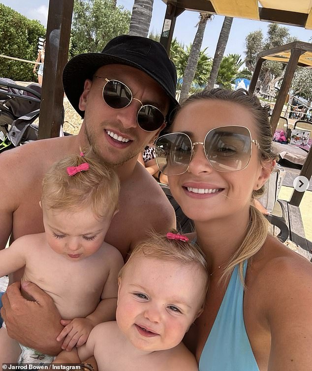 In a family snap, Dani looked gorgeous as she beamed while taking a selfie with her twin daughters Summer and Star and Jarrod during their vacation