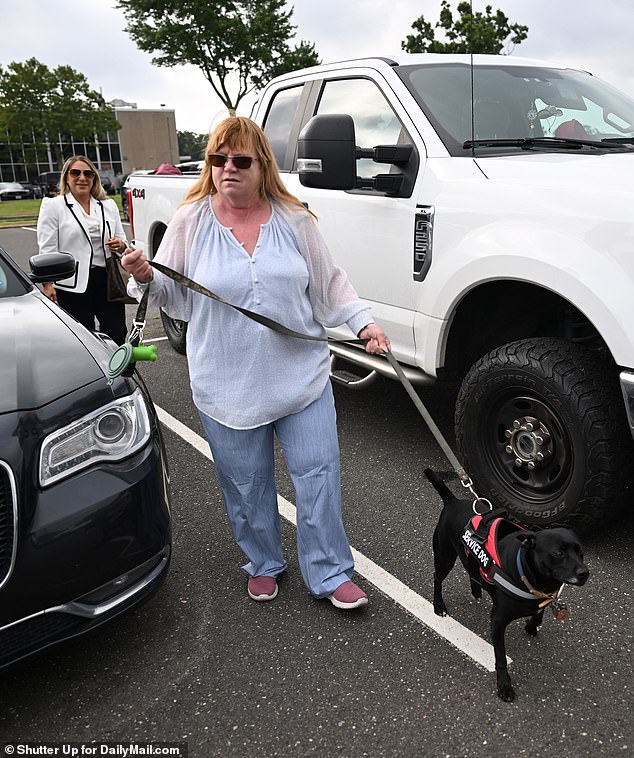 Asa Ellerup appears in court on Tuesday to show her support for her ex-husband Rex Heuermann. She appeared calm with her service dog in training by her side