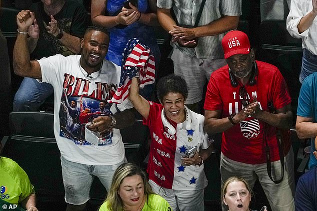 Owens cheered on his wife alongside Biles' parents, Nellie and Ron