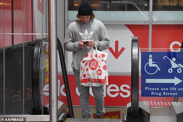 The latest figures have fuelled fears the RBA could raise interest rates despite borrowers already facing the most aggressive hikes since the late 1980s (pictured, a Coles customer)