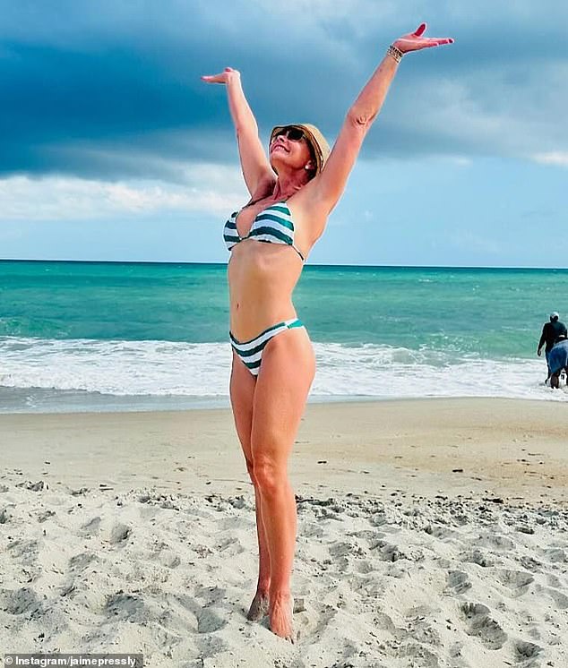 She showed off her toned figure wearing a green and white striped bikini top and matching bottoms