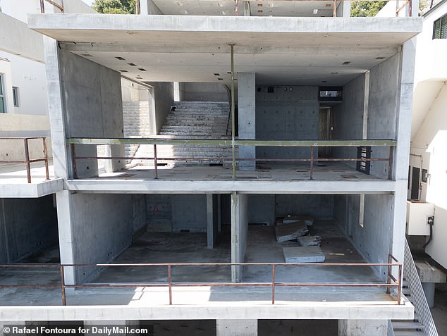 Photos taken in July showed the glass windows had been removed, leaving a clear view of the empty, concrete walls and floors