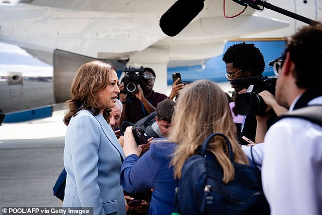 Kamala Harris talks to reporters