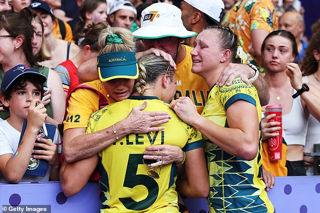 Pictured: Australian stars are consoled by the crowd after going from one of the favourites for gold to Paris empty-handed.