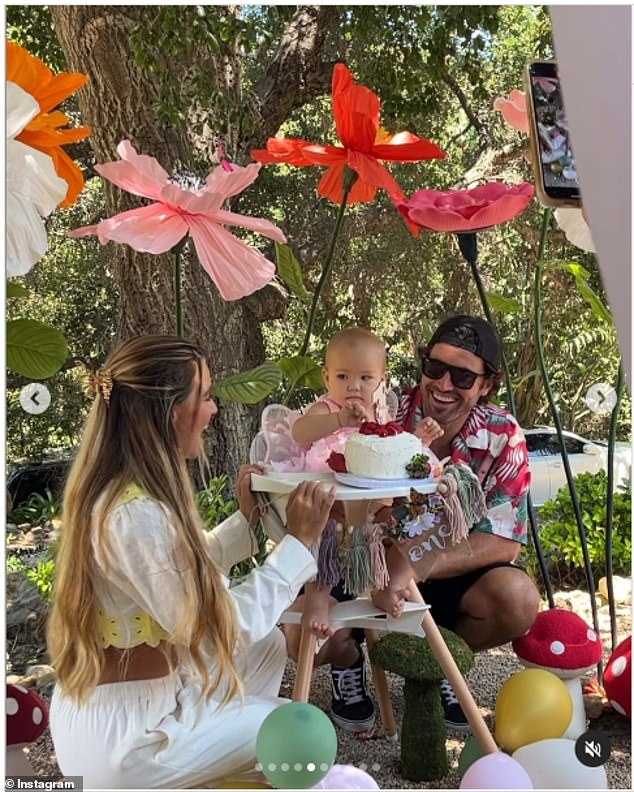 Tia looked gorgeous in a long-sleeved white linen crop top with yellow floral embroidery on the hems