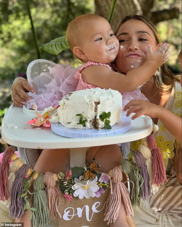 She celebrated by hilariously throwing it all over her face - and Tia's face too