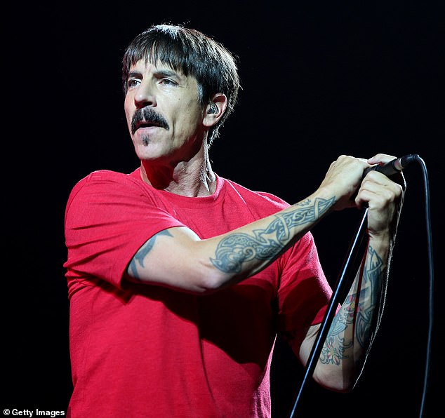 The band originally split in 1991, before Dave joined The Red Hot Chilli Peppers between 1993 and 1998, appearing on their album One Hot Minute (Chilli Peppers frontman Anthonu Kiedis pictured on stage)