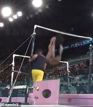 The gymnast fell from the uneven bars