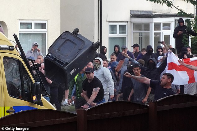 English flags were seen flying as riots broke out in Southport last night